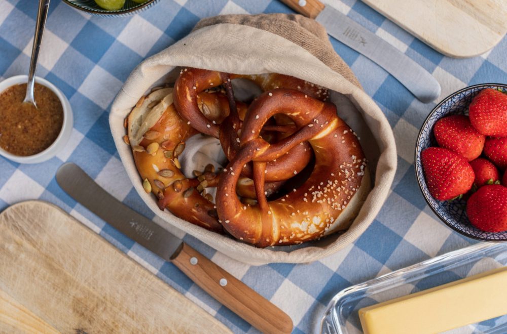 Large Pretzels on table with butter and mustard east side Austin Texas