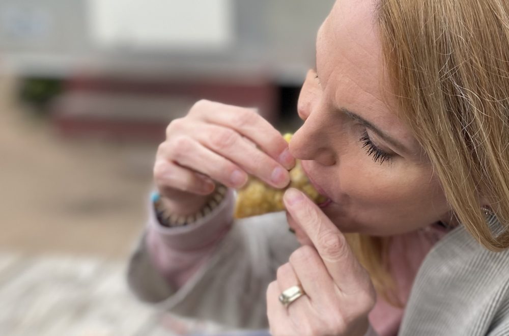 Woman eating Discada taco Austin eastside