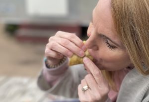 Woman eating Discada taco Austin eastside