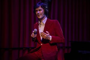 Joan manuel Serrat singing at the Barcelona Wax Museum