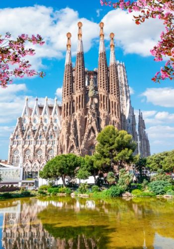 Sagrada-Familia-Basilica-as-seen-across the water in spring in Barcelona