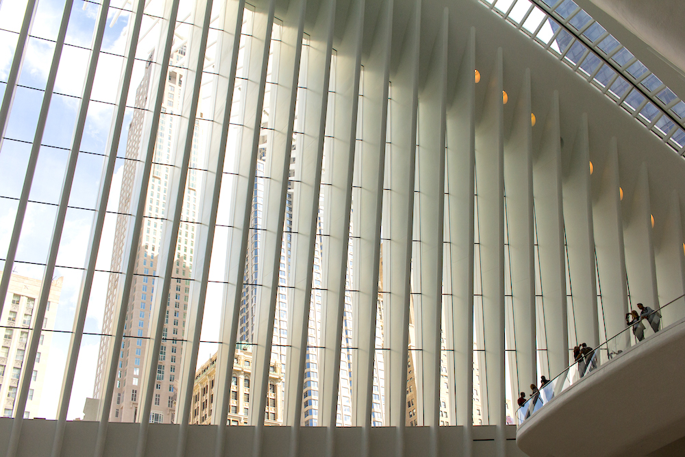 Inside the Oculus NYC with views of New York skyscrapers