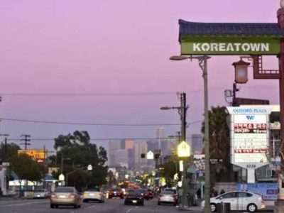 Koreatown sign with pink sky in background.