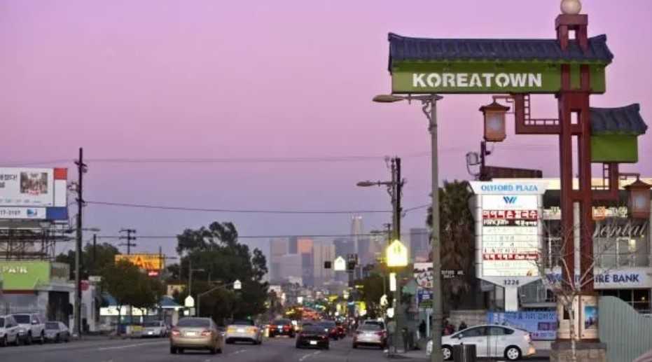 Koreatown sign with pink sky in background.