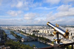 binocular attached to a balcony of eiffel metal structure