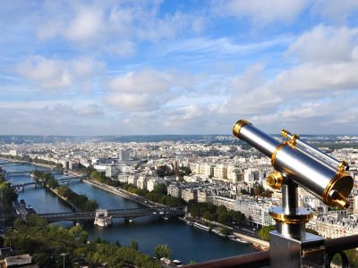binocular attached to a balcony of eiffel metal structure