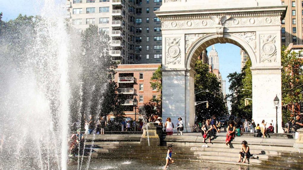 fountain, kids and triumphal arch in greenwhich village