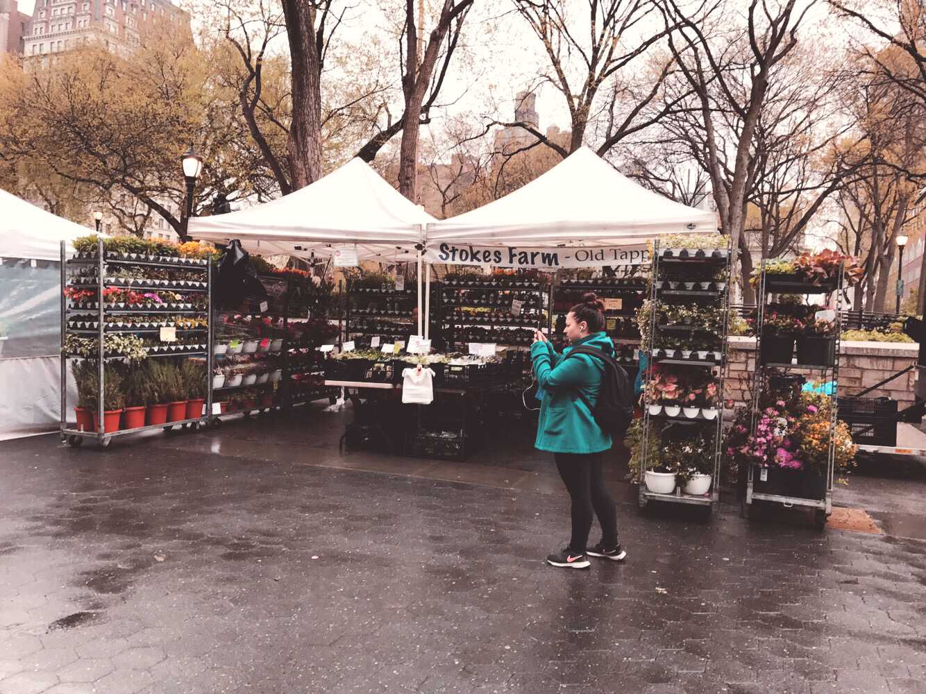 Person taking a photo in front of a tent