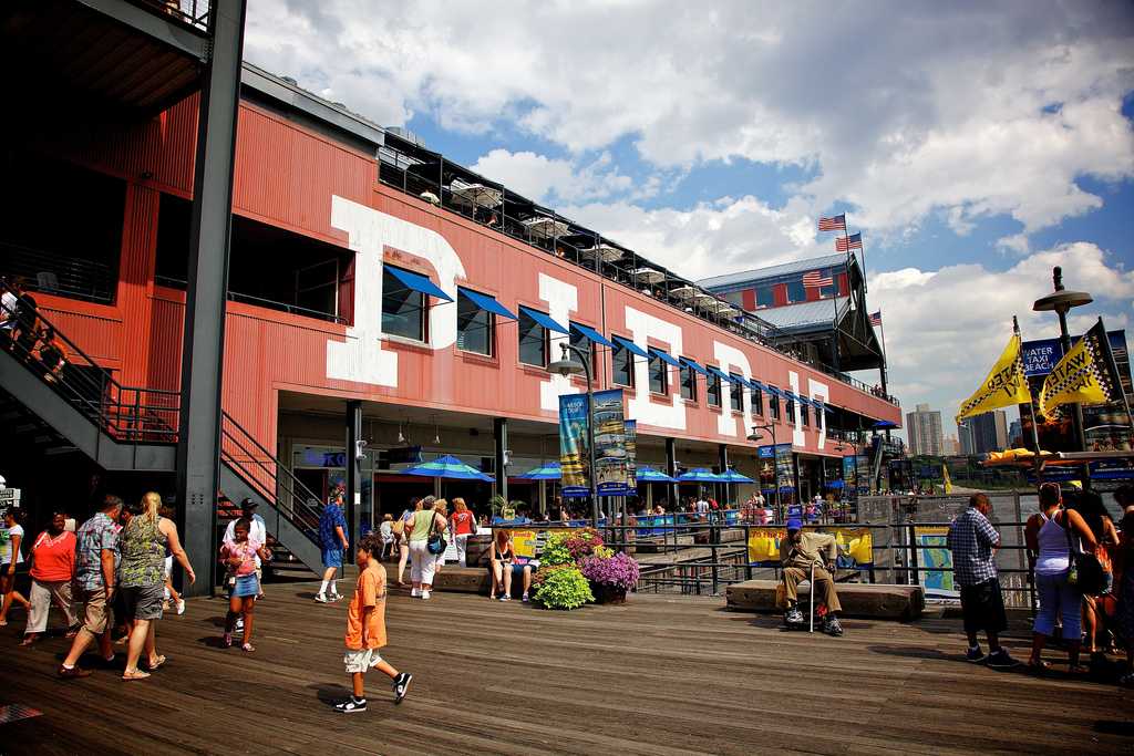 People walking on a pier