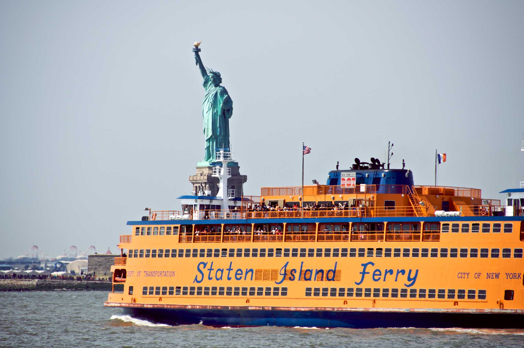 Staten Island Ferry with Statue of Liberty behind it