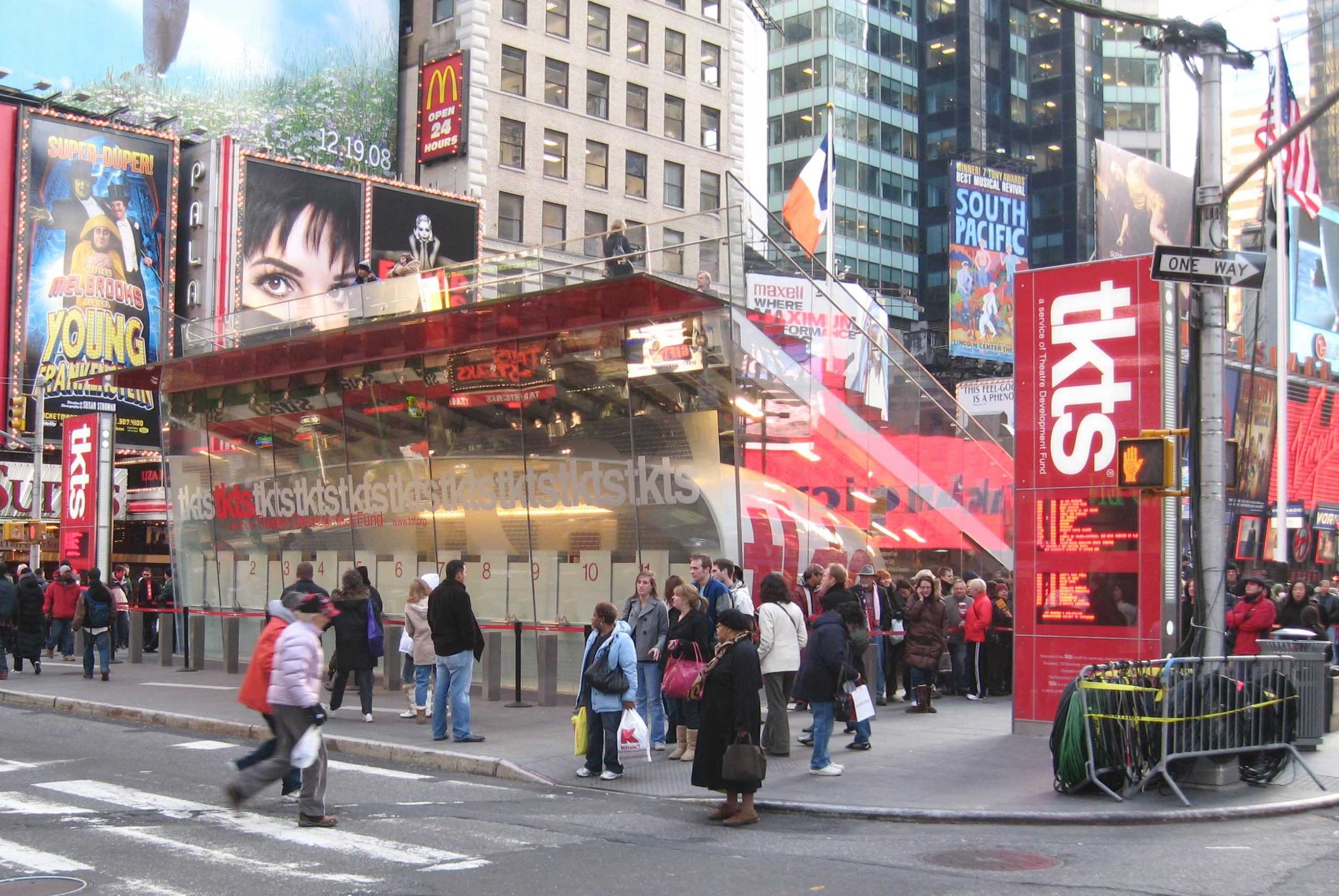 People standing around a box office booth