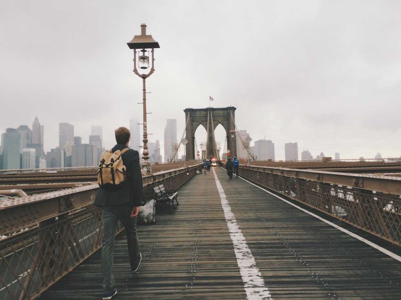 Man walking on bridge