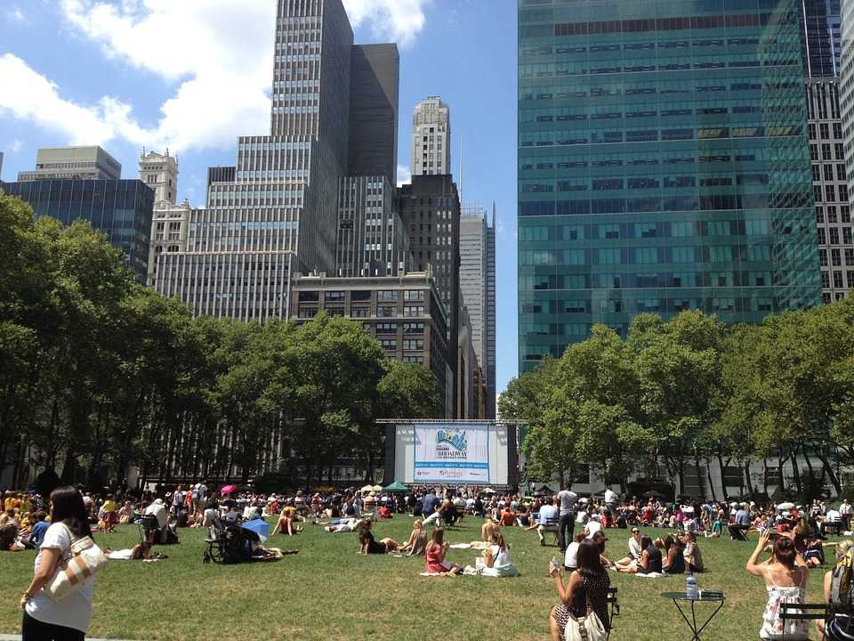 People standing and sitting in a park