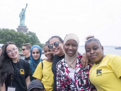 Students in front of Statue of Liberty