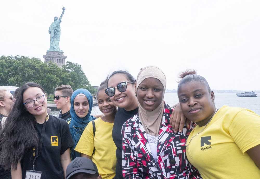 Students in front of Statue of Liberty