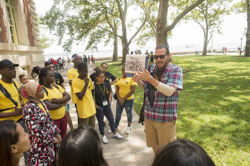 Man showing guests pictures