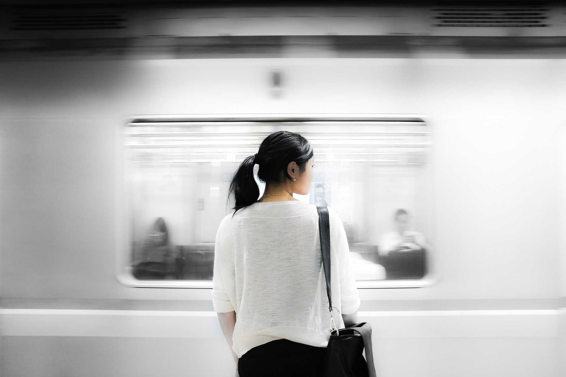 Woman in front of subway