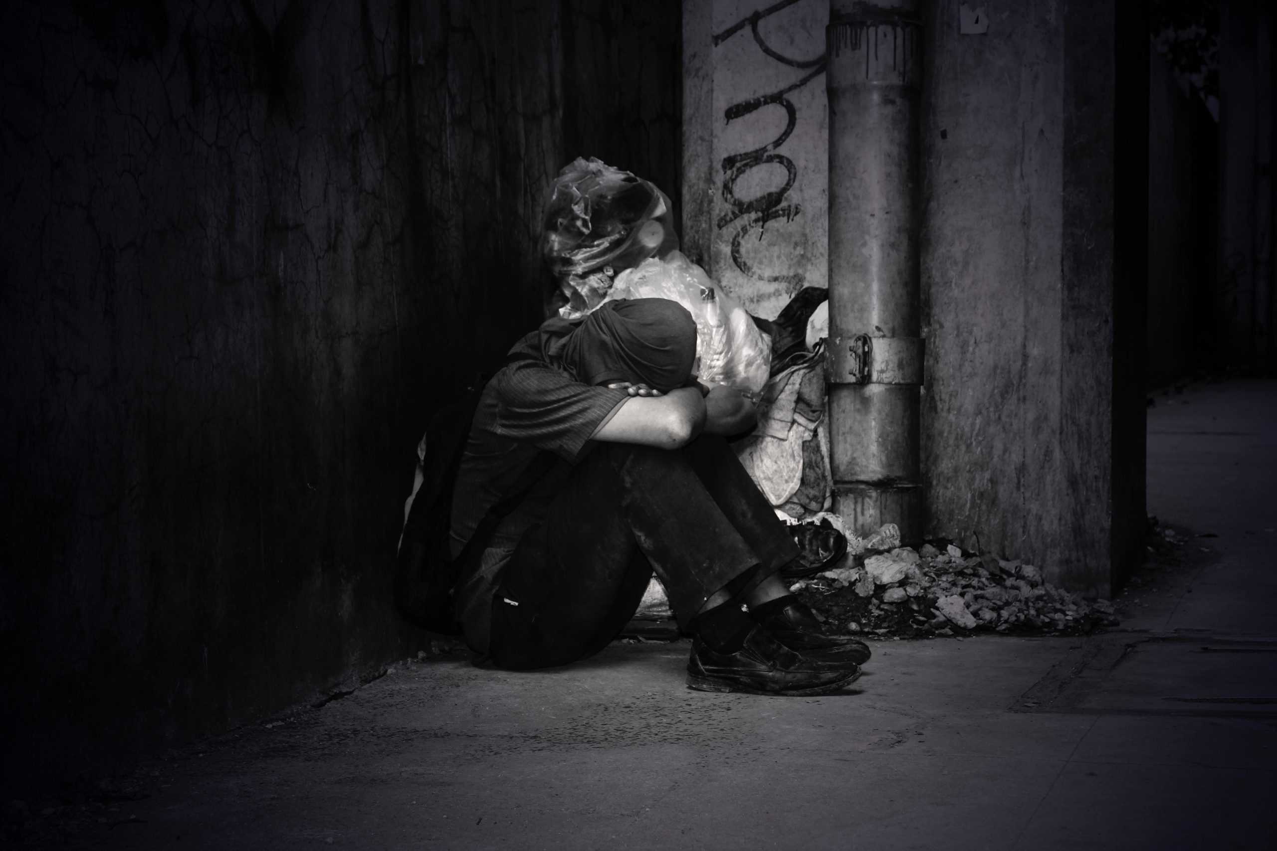 black and white photo of homeless man