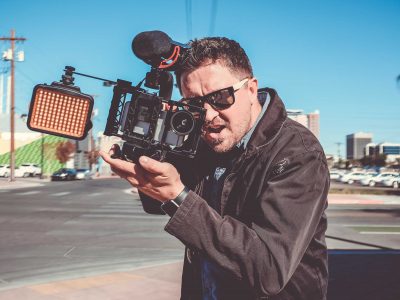 Man Filming in the middle of the street