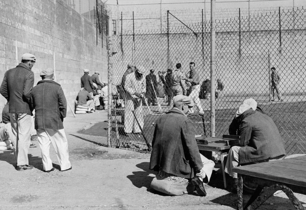 Prisoners gathered in the Alcatraz prison yard as shown in a historic image