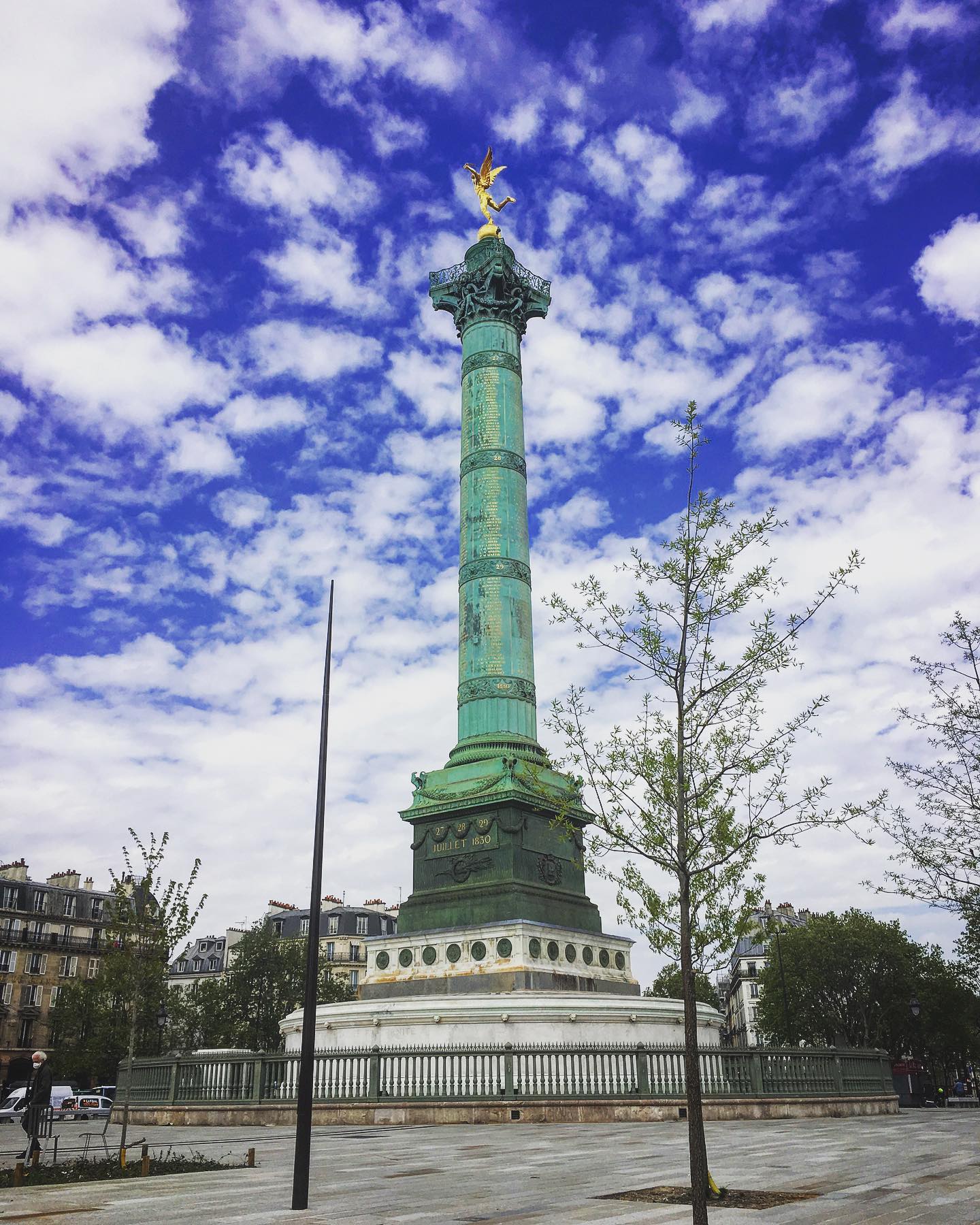 The Bastille monument with blue sky and white clouds