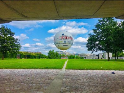 Hot air balloon in Paris on green grass