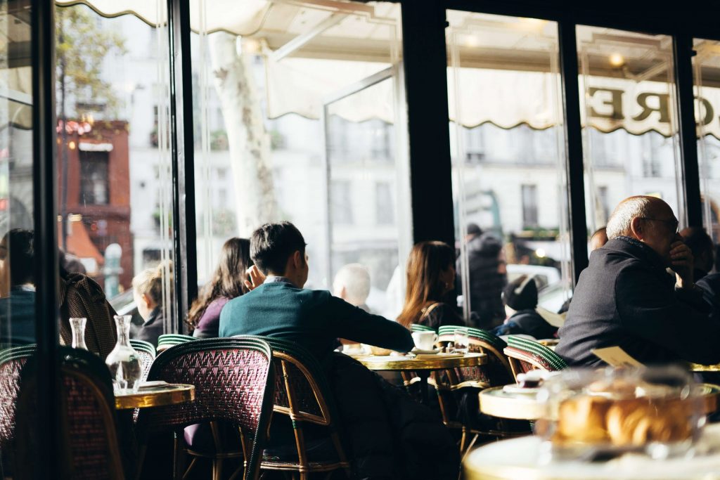 Inside a Parisian café famous for hosting legendary literature and artistic influences.