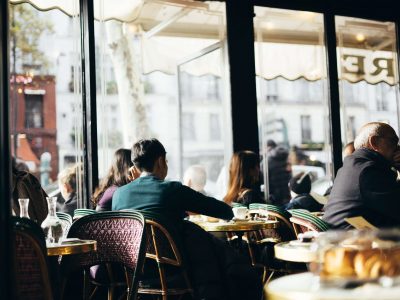 Inside a Parisian café famous for hosting legendary literature and artistic influences.