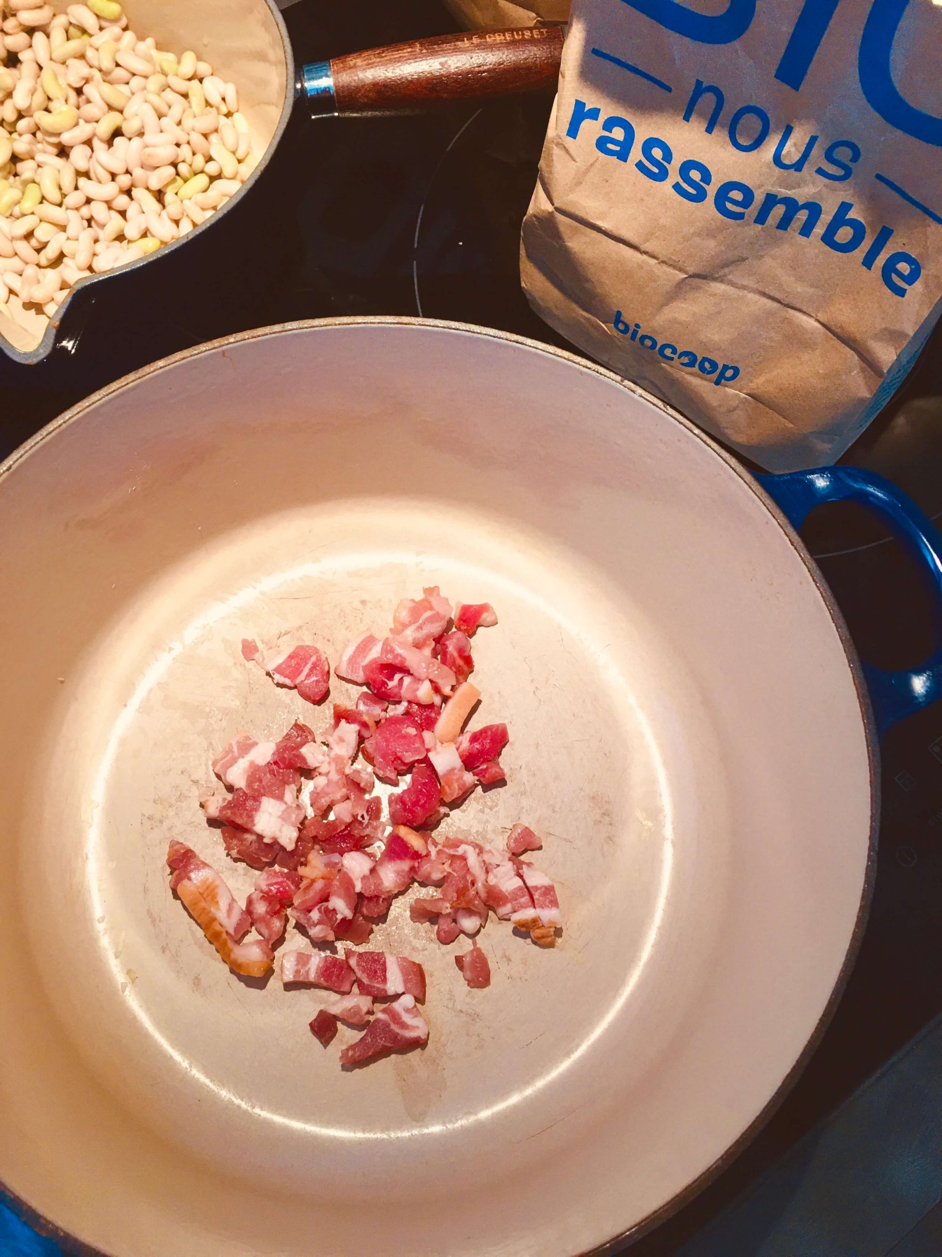 Lardons sauteeing in a dutch oven