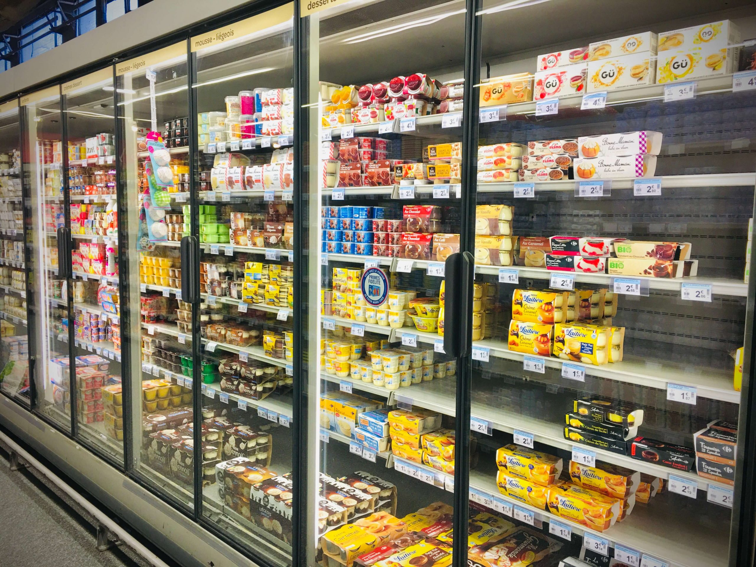 A refrigerator case of dairy products