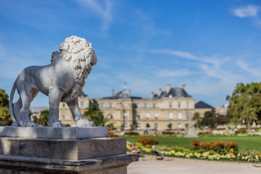 Luxembourg Gardens, largest in Paris, with lion statue in foreground