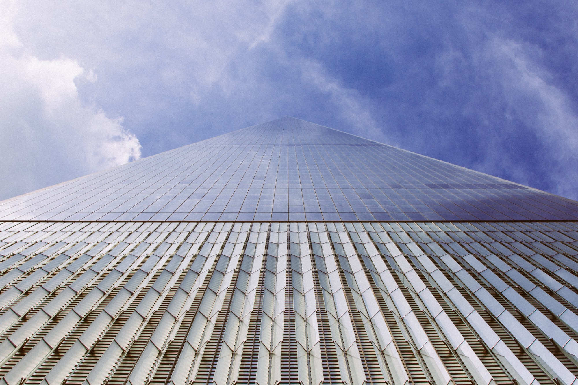 A view looking up One World Trade in NYC from the ground