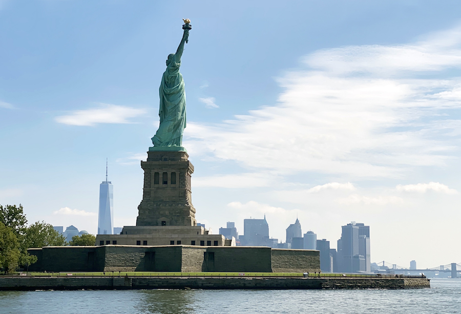 Statue of Liberty with the skyline in the background as seen July 2020 during the COVID-19 crisis