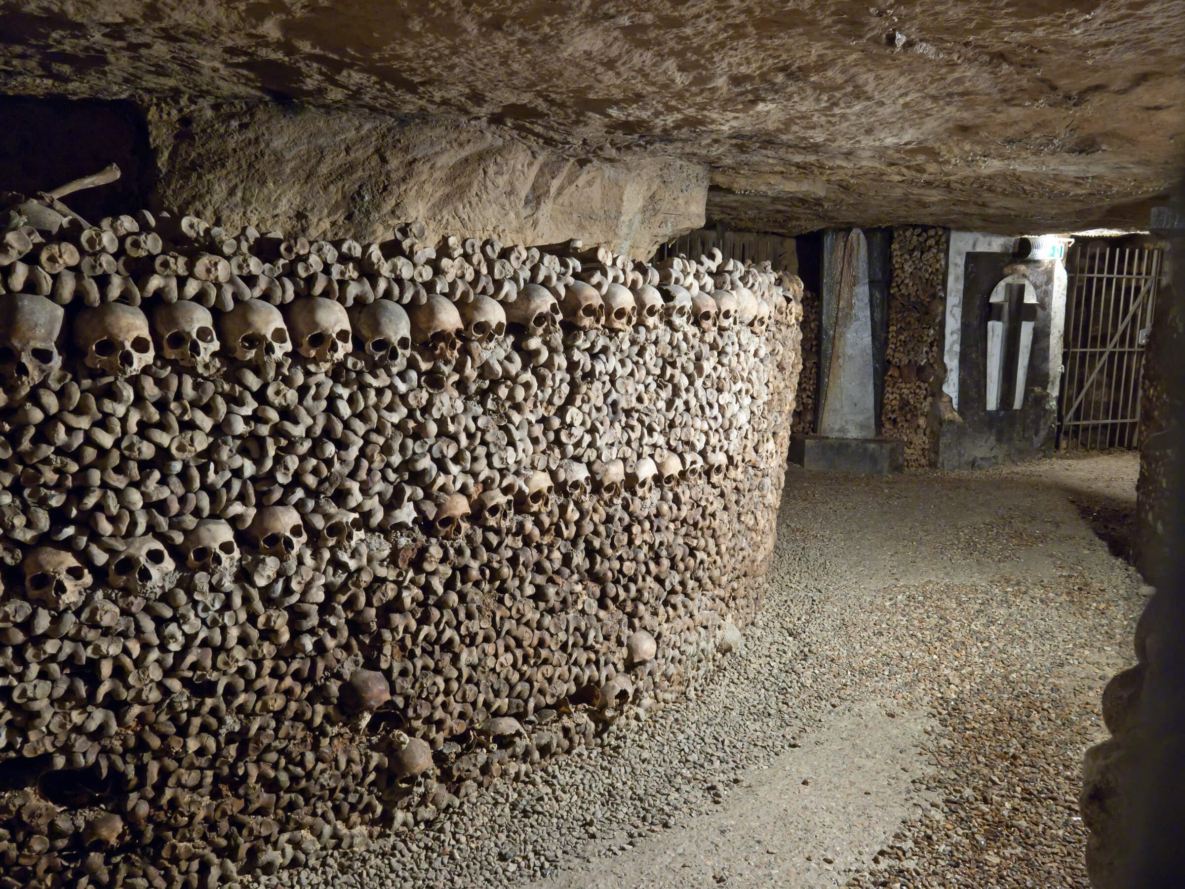 rows of skulls and bones underground in Paris