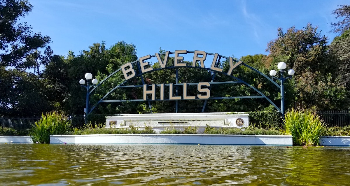 Beverly Hills sign in front of water