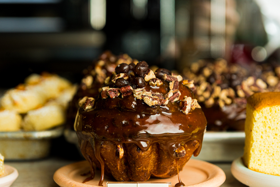 Breadbelly chocolate muffin surrounded by sweets