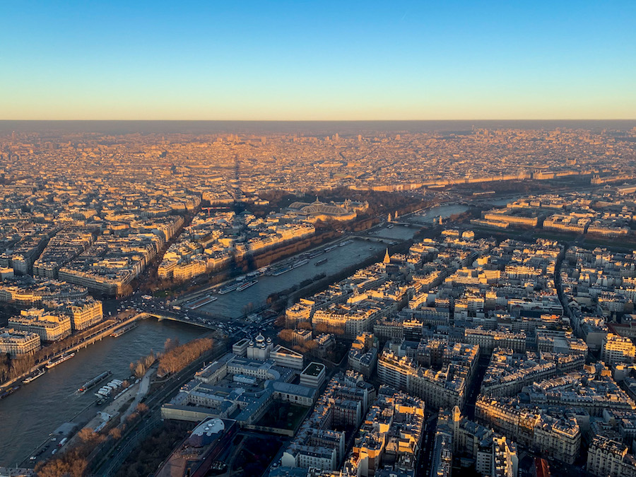 Rooftop views and the shadow of the Eiffel Tower from its summit