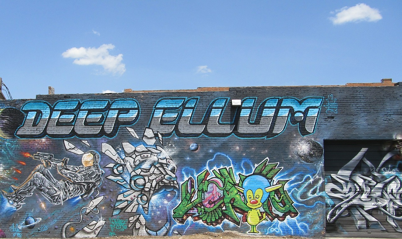 Graffiti-style mural with the Deep Ellum neighborhood name