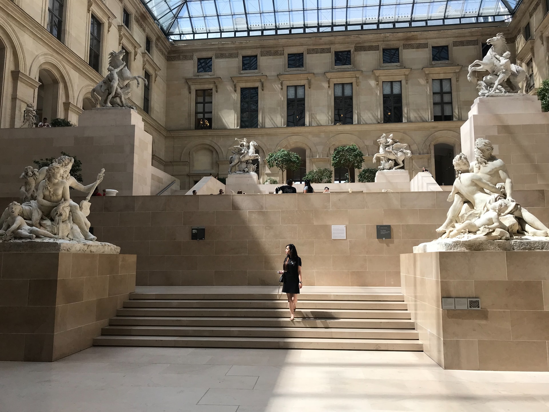 Louvre floors of art with sculptures and steps