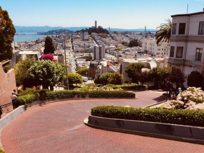Lombard Street in SF with view of Bay Bridge