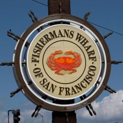 Fishermans Wharf sign with crab in the center