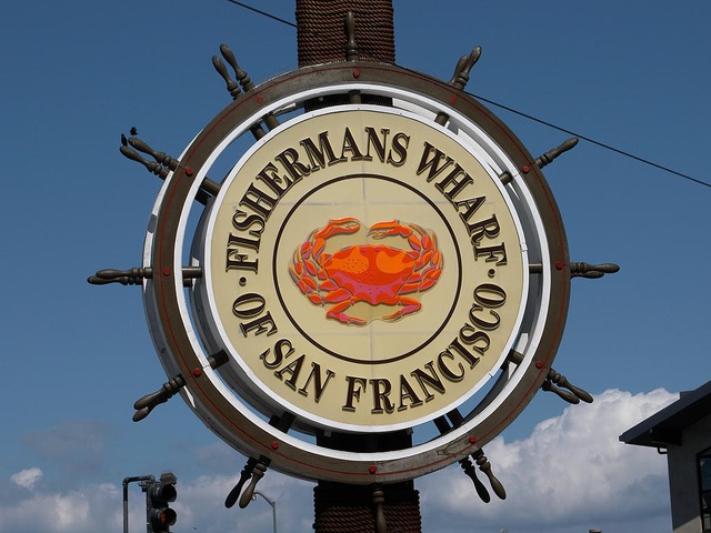 Fishermans Wharf sign with crab in the center