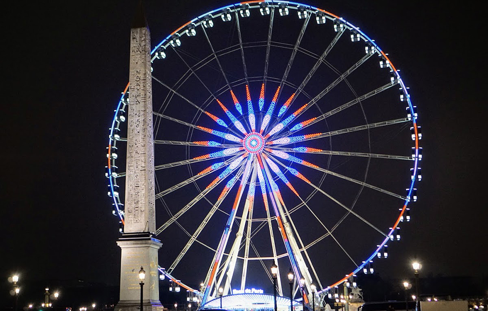 Ferris wheel in Paris lit up on a December night