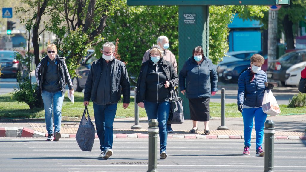 Pedestrians walking with masks