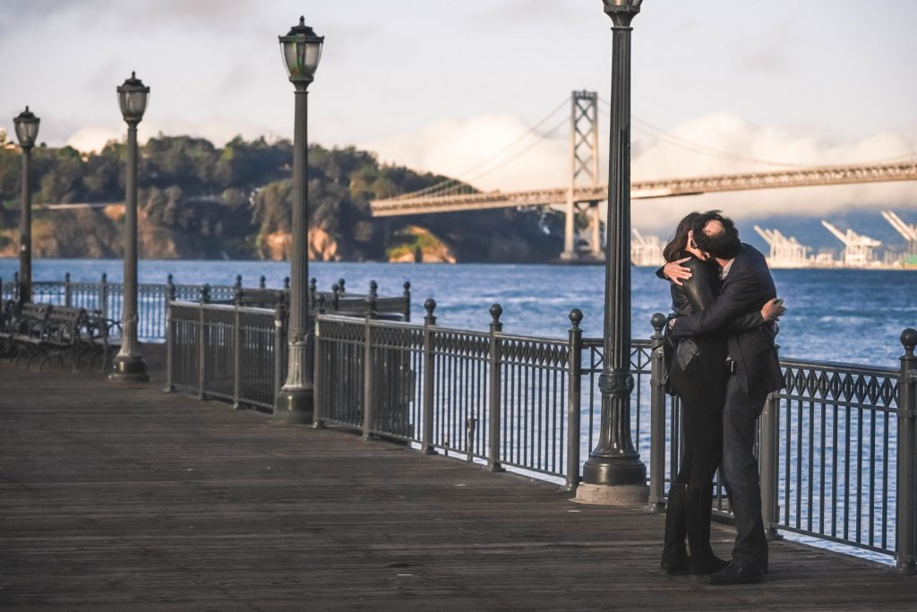 Couple kissing at the Embarcadero in SF