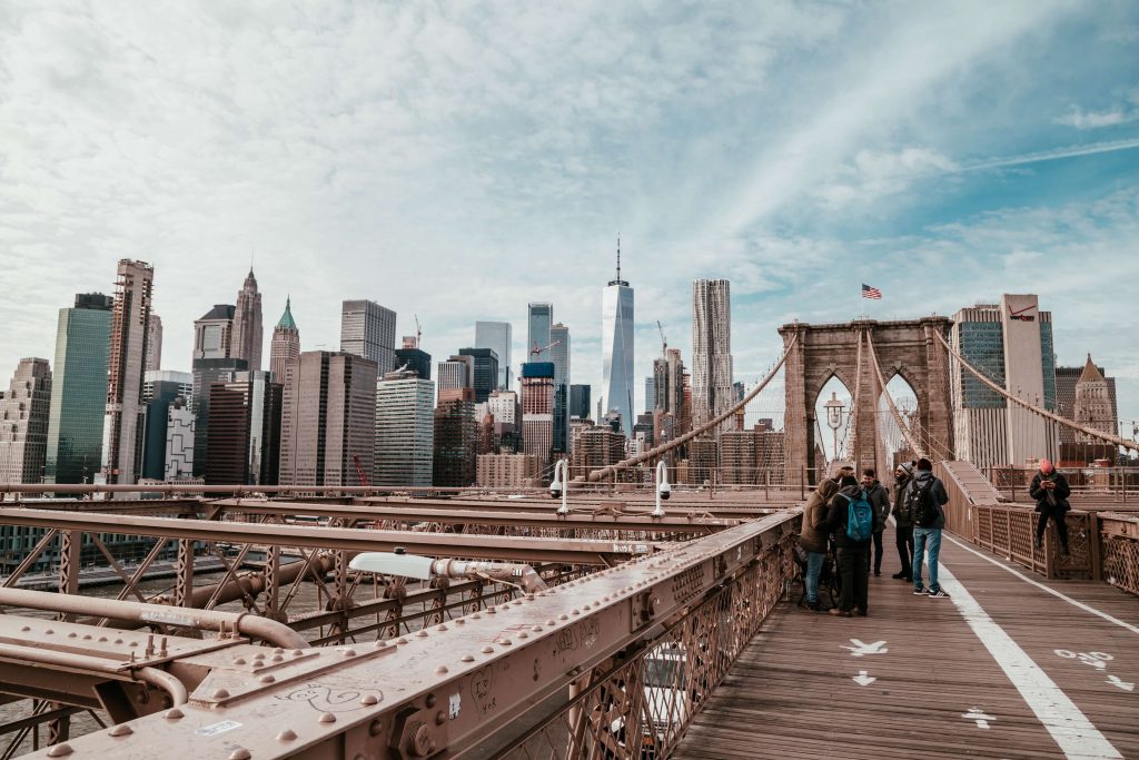 People walking across the Brooklyn Bridge