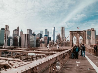 People walking across the Brooklyn Bridge