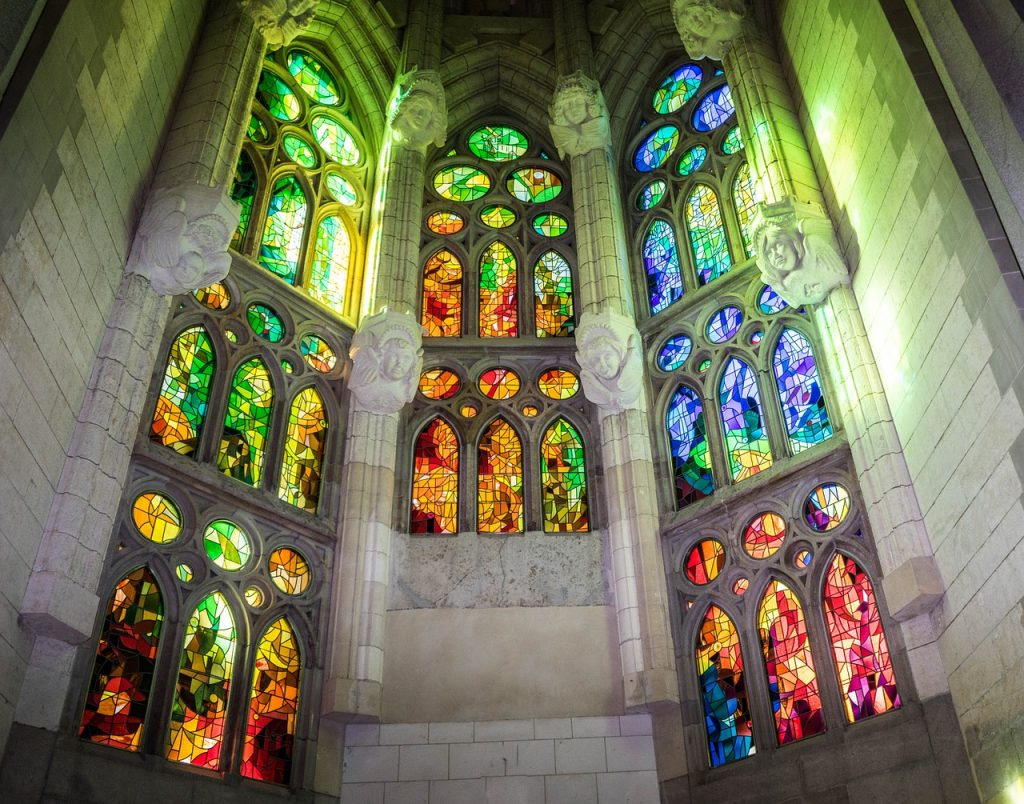 Sagrada Familia basilica in Barcelona with lit stained glass interior