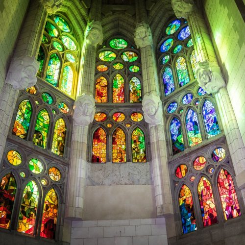 Sagrada Familia basilica in Barcelona with lit stained glass interior