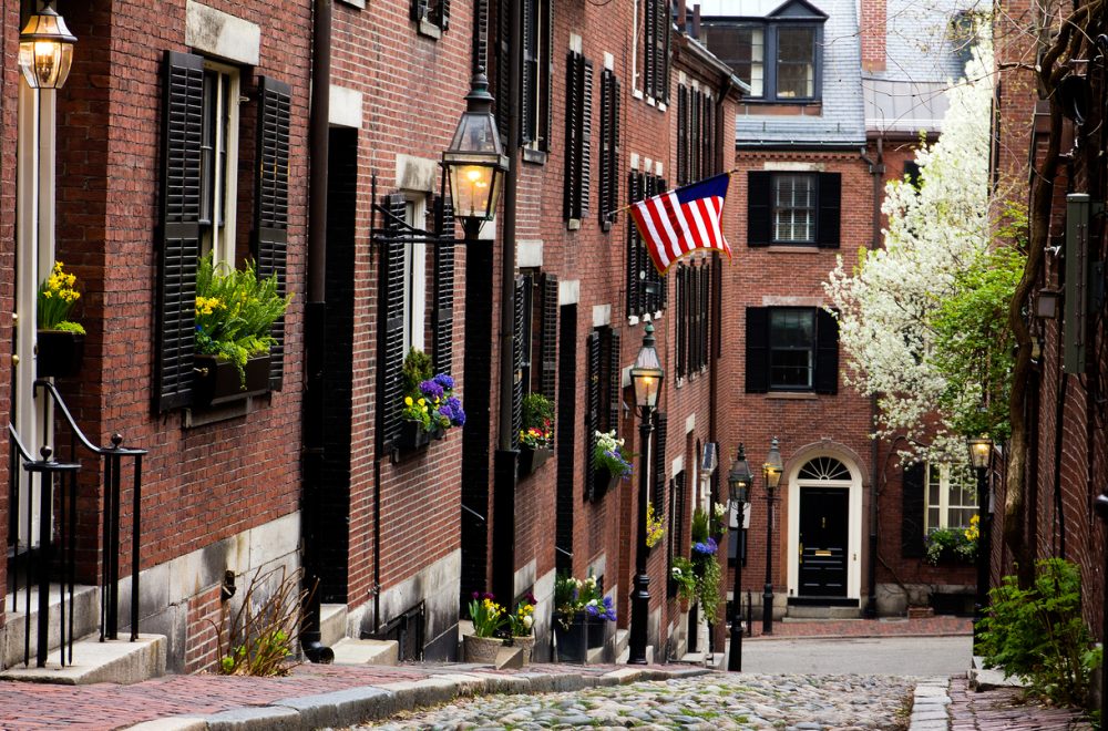 View of the historic architecture of Boston in Massachusetts, USA at Beacon hill showcasing its cobblestone street and colonial buildings on Boston walking tour